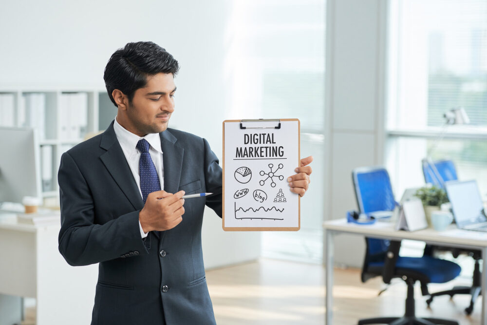 Digtial marketing explaining by a man in office setting